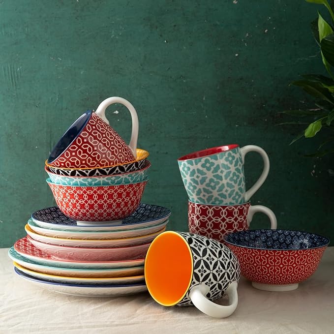 Collection of Dowan & Vantray kitchen dinnerware including assorted ceramic bowls, plates, and drinkware for home dining.